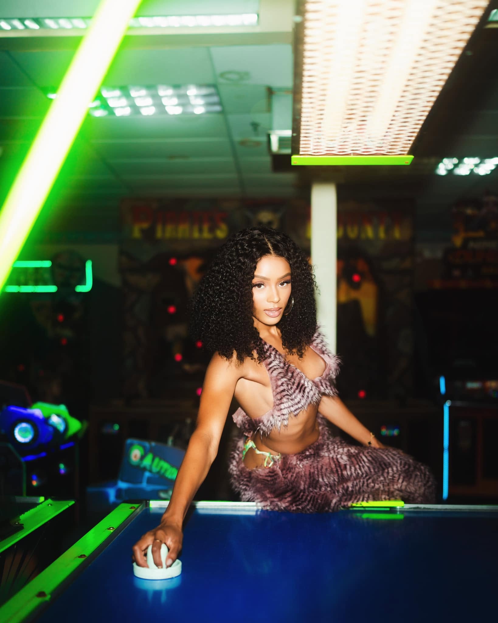 Editorial portrait in an arcade