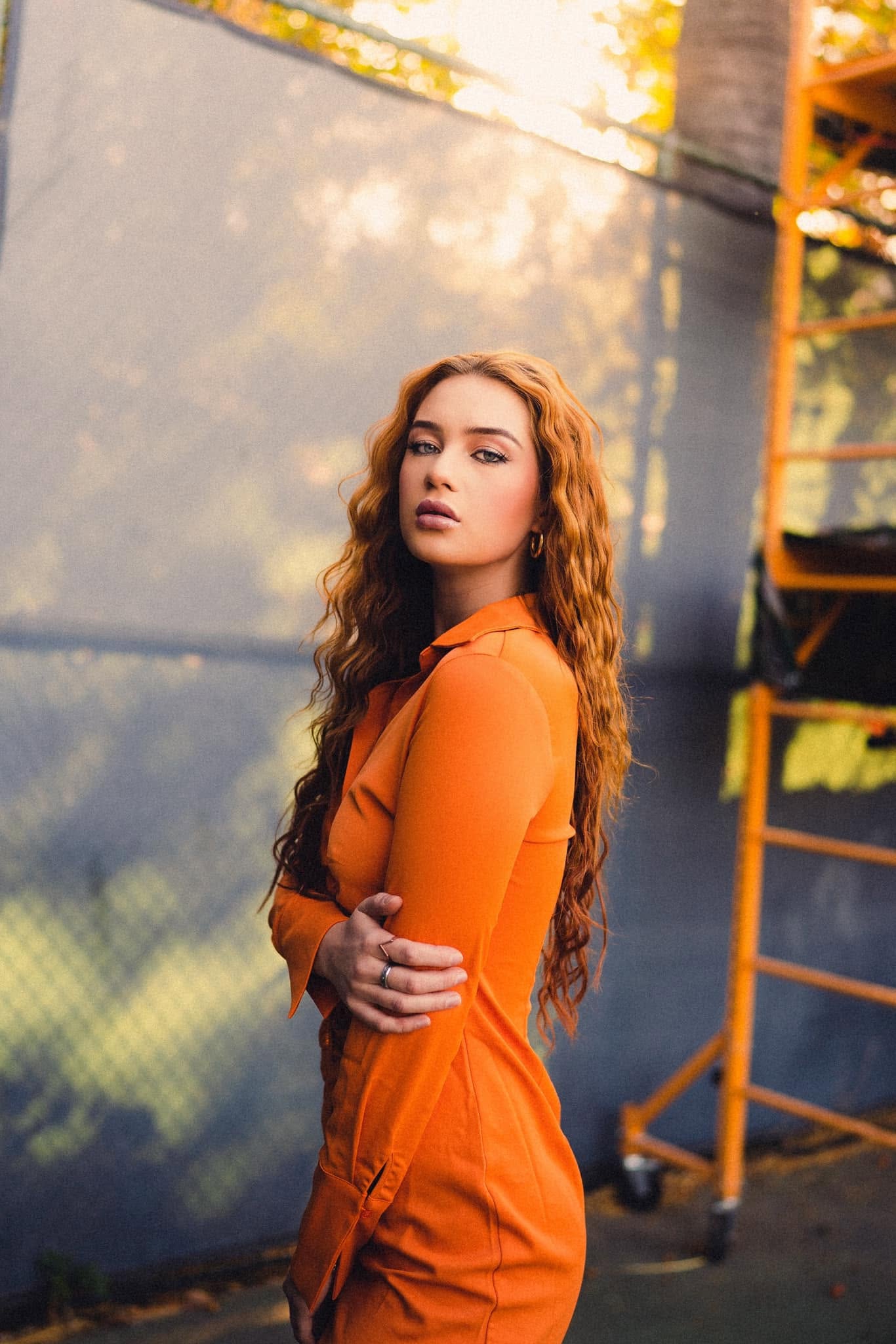 Editorial portrait in an orange outfit