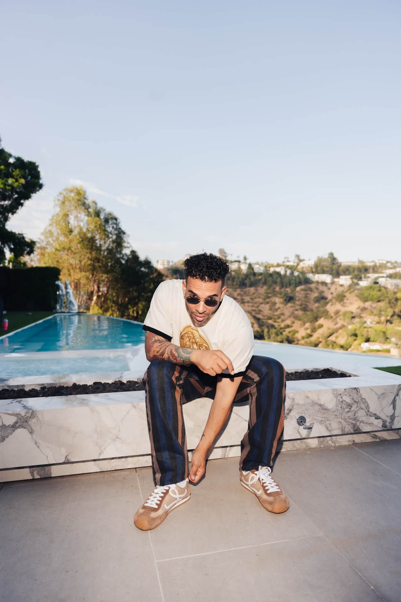 Outdoor editorial portrait by a pool